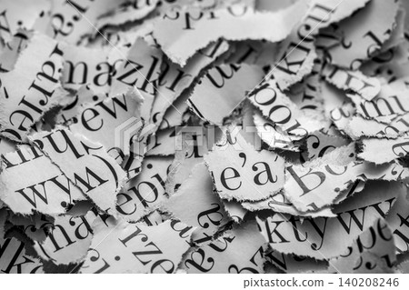 Scraps of paper with words and letters from magazines and newspapers. Newspaper paper strips background. Scraps of paper with words and letters from magazines and newspapers. Newspaper paper strips background. 140208246