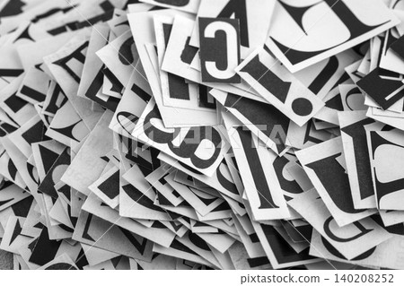 Pile of many black and white letters from newspapers and magazines. Typography background composition. 140208252