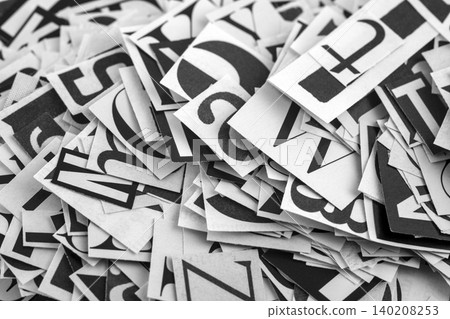 Pile of many black and white letters from newspapers and magazines. Typography background composition. Pile of many black and white letters from newspapers and magazines. Typography background composition. 140208253