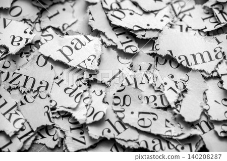 Scraps of paper with words and letters from magazines and newspapers. Newspaper paper strips background. Scraps of paper with words and letters from magazines and newspapers. Newspaper paper strips background. 140208287