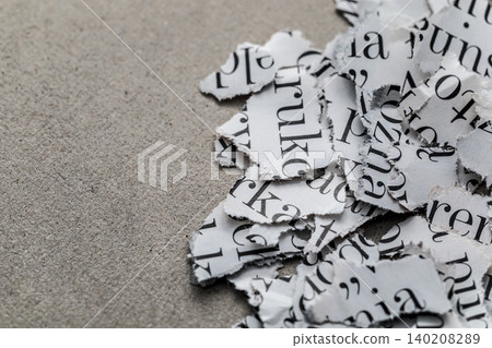 Scraps of paper with words and letters from magazines and newspapers Scraps of paper with words and letters from magazines and newspapers 140208289