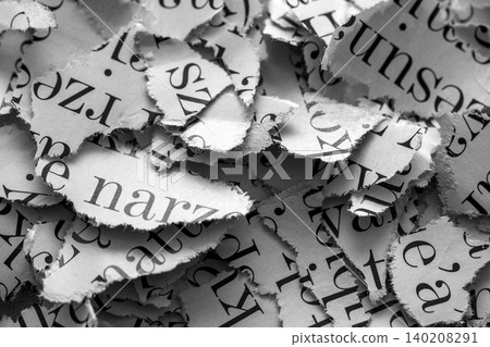 Scraps of paper with words and letters from magazines and newspapers. Newspaper paper strips background. 140208291