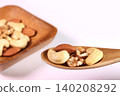 Mixed nuts served in a bowl and spoon 140208292