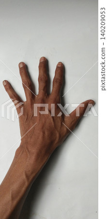 Close-up photo of a human hand with fingers separated, placed on a clean white background. Close-up photo of a human hand with fingers separated, placed on a clean white background. 140209053