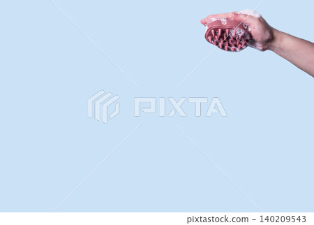 Pink head massager hair brush with silicone flexible hair care and head relaxation. Mock up isolated Pink head massager hair brush with silicone flexible hair care and head relaxation. Mock up isolated 140209543