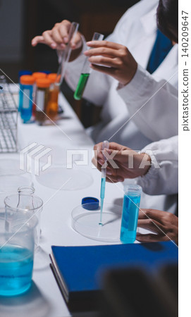 Researchers working in the clinical laboratory Researchers working in the clinical laboratory 140209647