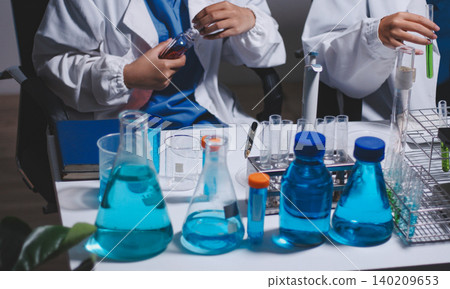 Researchers working in the clinical laboratory Researchers working in the clinical laboratory 140209653