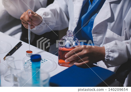 Researchers working in the clinical laboratory Researchers working in the clinical laboratory 140209654