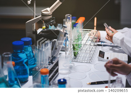Researchers working in the clinical laboratory Researchers working in the clinical laboratory 140209655