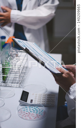 Researchers working in the clinical laboratory Researchers working in the clinical laboratory 140209665