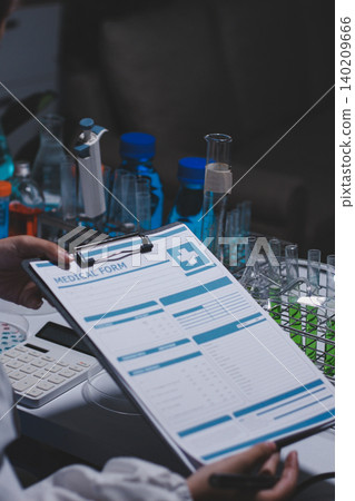 Researchers working in the clinical laboratory 140209666