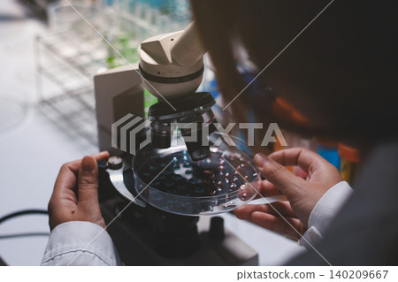 Researchers working in the clinical laboratory Researchers working in the clinical laboratory 140209667