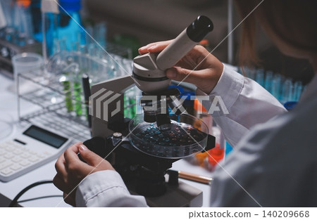 Researchers working in the clinical laboratory 140209668