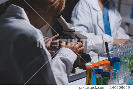 Researchers working in the clinical laboratory Researchers working in the clinical laboratory 140209669