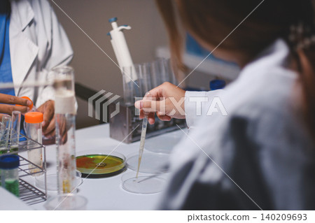 Researchers working in the clinical laboratory Researchers working in the clinical laboratory 140209693
