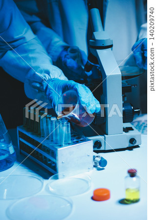 Researchers working in the clinical laboratory Researchers working in the clinical laboratory 140209740