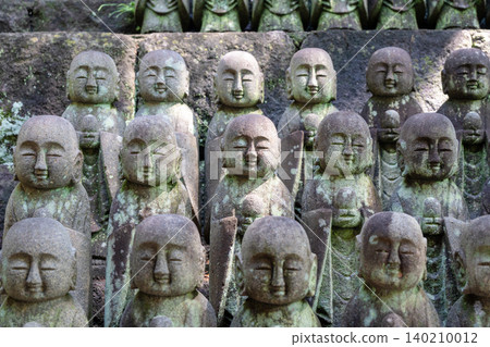 Rows of Jizo Bosatsu statues at Hase-dera temple in Kamakura Rows of Jizo Bosatsu statues at Hase-dera temple in Kamakura 140210012