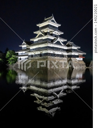 Night view of Matsumoto Castle reflecting in the water, Japan 140210021