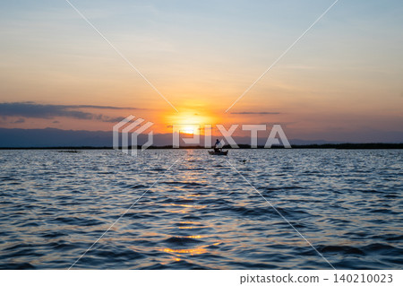 Boat at sunset on Lake Tempe, Sulawesi, Indonesia 140210023