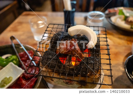 Grilled Hida Wagyu beef on traditional fire grill in Takayama 140210033