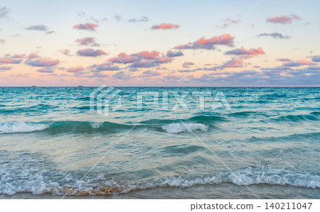 Sea horizon view. Cloudy sky and seascape at summer vacation. Skyscape with sea horizon. Calm horizon view at sea sunrise. Romantic summer vacation sunrise on seascape. Distant sea horizon Sea horizon view. Cloudy sky and seascape at summer vacation. Skyscape with sea horizon. Calm horizon view at sea sunrise. Romantic summer vacation sunrise on seascape. Distant sea horizon 140211047