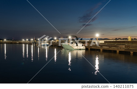 Night view. Yacht club. Marina in night. Summer vacation. Downtown city marina with luxury yacht illumination. Docked vessels. Luxury yacht in night marina. Evening yachting. Luxury yacht at night Night view. Yacht club. Marina in night. Summer vacation. Downtown city marina with luxury yacht illumination. Docked vessels. Luxury yacht in night marina. Evening yachting. Luxury yacht at night 140211075