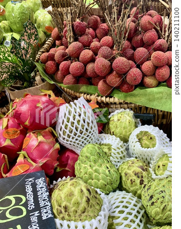 Tropical fruits such as lychee and dragon fruit sold in Thai supermarkets Tropical fruits such as lychee and dragon fruit sold in Thai supermarkets 140211100
