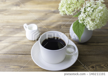 A natural lifestyle with Annabelle hydrangeas and coffee. A natural lifestyle with Annabelle hydrangeas and coffee. 140211101