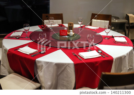 Beautifully set dining table with cutlery in a stylish, modern restaurant interior Beautifully set dining table with cutlery in a stylish, modern restaurant interior 140211300