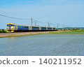 Rice paddy fields stretching across the countryside and the Limited Express Ayame train. 140211952