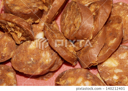 Close up of chorizo sliced cooking frying food preparation for meal Close up of chorizo sliced cooking frying food preparation for meal 140212401