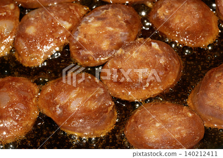 Close up of chorizo sliced cooking frying food preparation for meal Close up of chorizo sliced cooking frying food preparation for meal 140212411