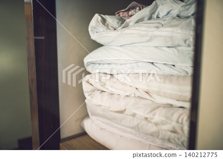A closet filled with futons A closet filled with futons 140212775