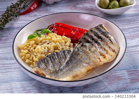 Grilled seabass fillet with ptitim and red pepper 140213304