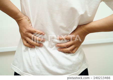 Asian man pain back muscle, spine and bone from accident. Asian man pain back muscle, spine and bone from accident. 140213466