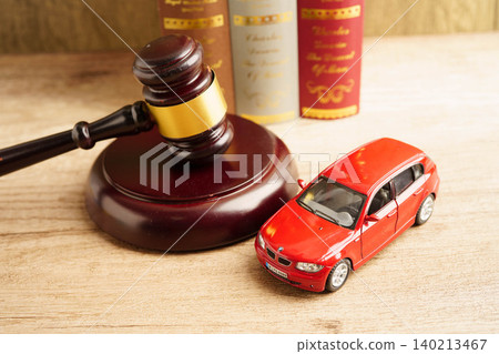 Bangkok, Thailand March 15, 2023 Car accident lawsuit and insurance, Judge hammer with car model. Bangkok, Thailand March 15, 2023 Car accident lawsuit and insurance, Judge hammer with car model. 140213467