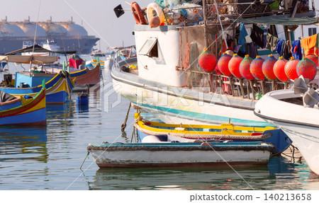 Colorful fishing boats in Marsaxlokk harbor Malta Colorful fishing boats in Marsaxlokk harbor Malta 140213658