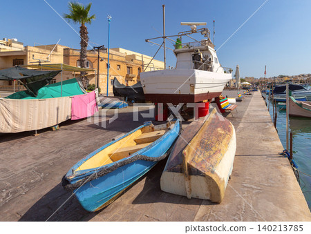 Fishing boat on quay in Marsaxlokk harbor Malta Fishing boat on quay in Marsaxlokk harbor Malta 140213785
