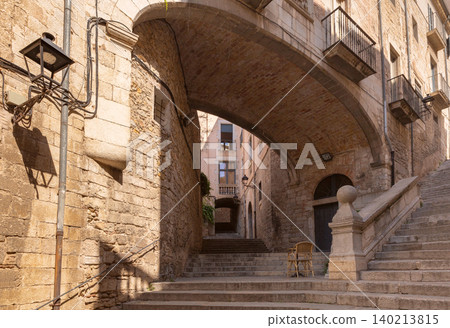 Historic stone archway and stairs in old town Girona Catalonia Spain Historic stone archway and stairs in old town Girona Catalonia Spain 140213815