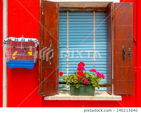 Colorful window with wooden shutters and flower box on Burano Island Italy Colorful window with wooden shutters and flower box on Burano Island Italy 140213840