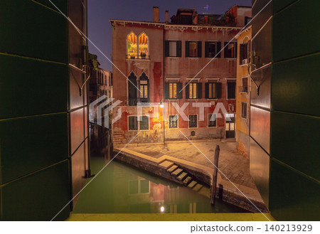 Night view of Venice canal from open window, Italy Night view of Venice canal from open window, Italy 140213929
