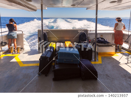 Passenger ferry deck with luggage and sea wake near Rhodes on sunny summer day 140213937