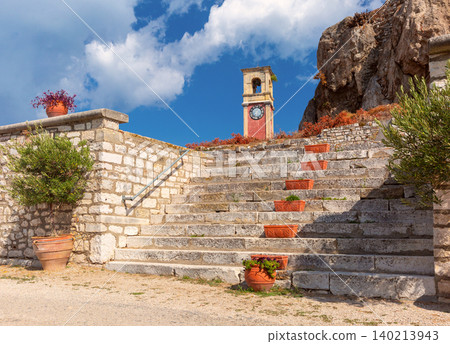 Stone staircase with clock tower in Corfu, Greece Stone staircase with clock tower in Corfu, Greece 140213943