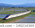E8 series Yamagata Shinkansen running through a rural landscape 140214369
