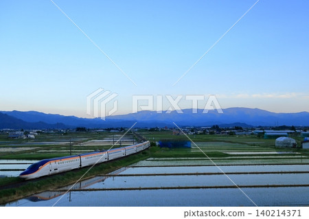 Shinkansen train running in the sunset 140214371