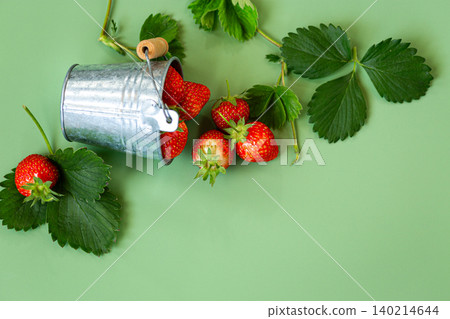 Juicy red strawberries with natural green foliage Juicy red strawberries with natural green foliage 140214644
