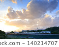 A commuter train running in the setting sun 140214707