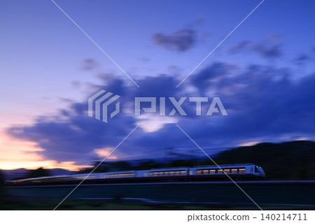 The Romancecar runs bathed in the setting sun. 140214711