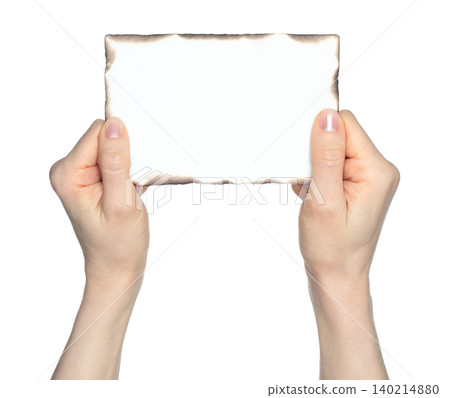 Hands holding an old paper sheet with burned edges isolated on transparent background. Vintage document concept with fire damage, ideal for history, mystery, and creative design themes Hands holding an old paper sheet with burned edges isolated on transparent background. Vintage document concept with fire damage, ideal for history, mystery, and creative design themes 140214880