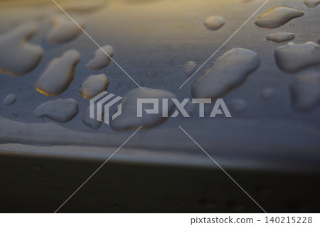 Raindrops on a handrail (horizontal) Raindrops on a handrail (horizontal) 140215228